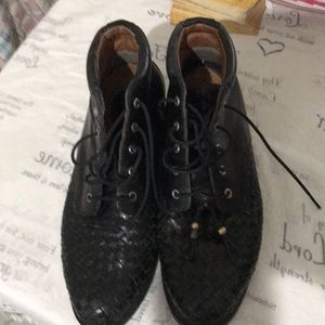 Black pair of ankle booths